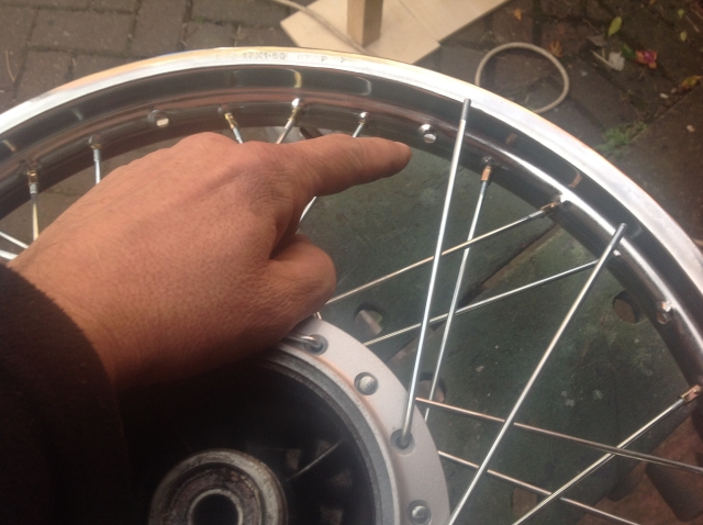 fitting the final spokes after flipping the wheel over